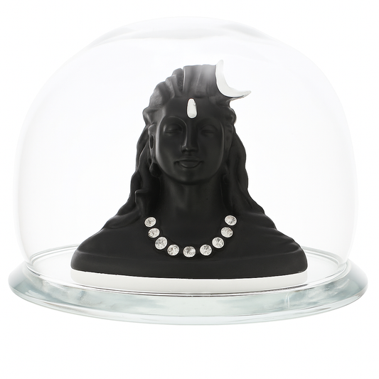 Finely sculpted Lord Shiva bust with crescent moon and decorative necklace  Enclosed in a durable, polished glass dome for an elegant display  Ideal for all home, office, spiritual environments, or car dashboard.